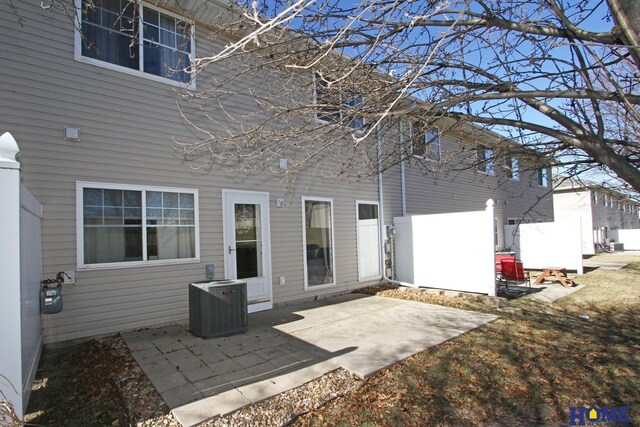 back of property with a patio and central air condition unit