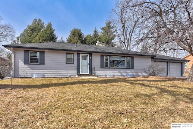 single story home featuring a garage and a front yard