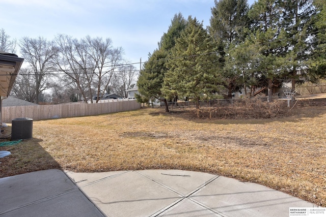 view of yard with cooling unit and fence