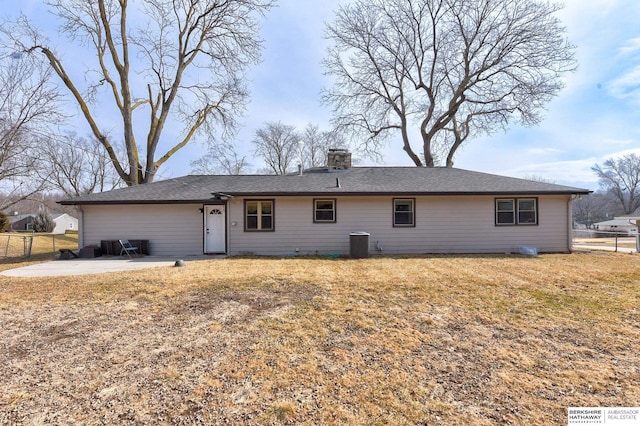 back of property featuring a patio, central AC unit, a chimney, and fence