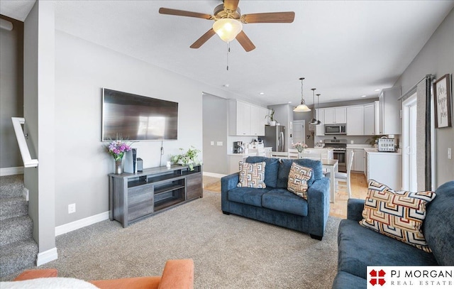 10211 Rosewater Pkwy, Bennington, NE 68007 - living area with recessed lighting, a ceiling fan, light carpet, baseboards, and stairs
