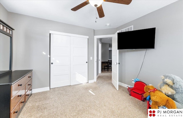 10211 Rosewater Pkwy, Bennington, NE 68007 - recreation room featuring a ceiling fan, light carpet, visible vents, and baseboards