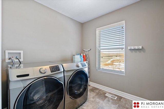 10211 Rosewater Pkwy, Bennington, NE 68007 - laundry area featuring laundry area, baseboards, visible vents, and independent washer and dryer