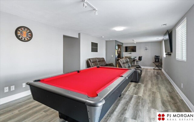 10211 Rosewater Pkwy, Bennington, NE 68007 - playroom with rail lighting, visible vents, baseboards, and wood finished floors