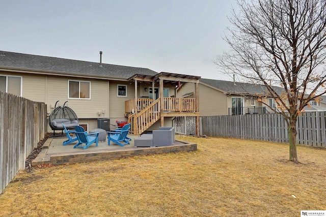 rear view of house with a lawn, a patio area, a fenced backyard, and a pergola