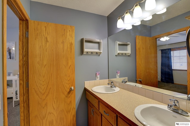 bathroom featuring double vanity and a sink