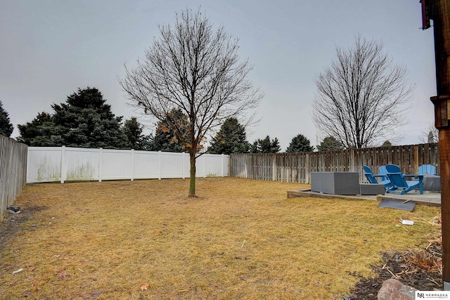 view of yard with a fenced backyard and a patio