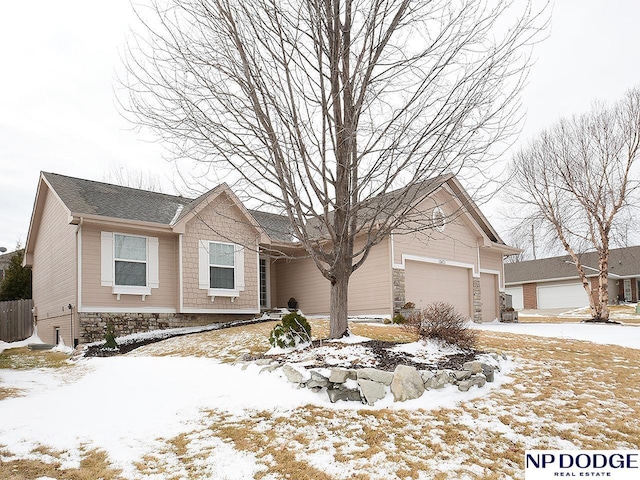 single story home featuring a garage