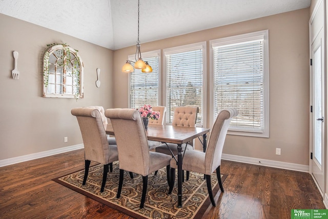 dining area featuring baseboards, dark wood-type flooring, and a healthy amount of sunlight