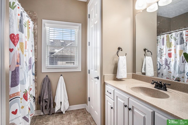 full bath with tile patterned flooring, baseboards, vanity, and a shower with curtain