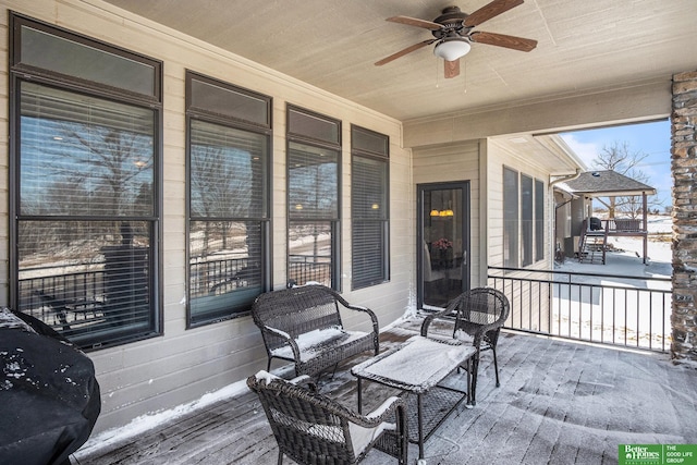 snow covered deck featuring a ceiling fan