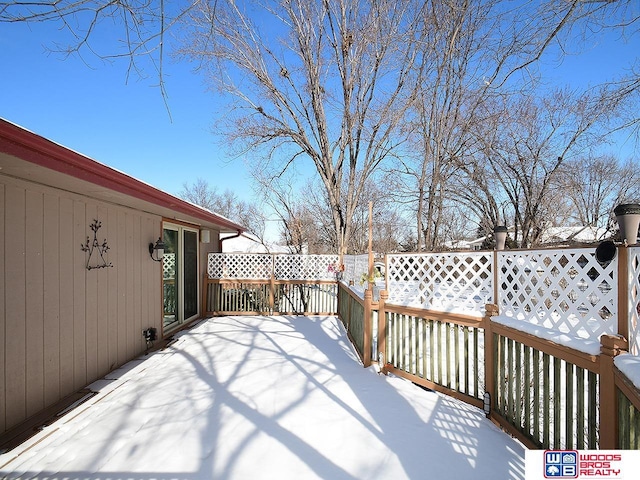 view of snow covered deck