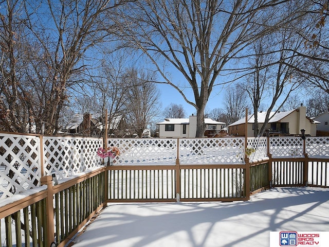 view of snow covered deck