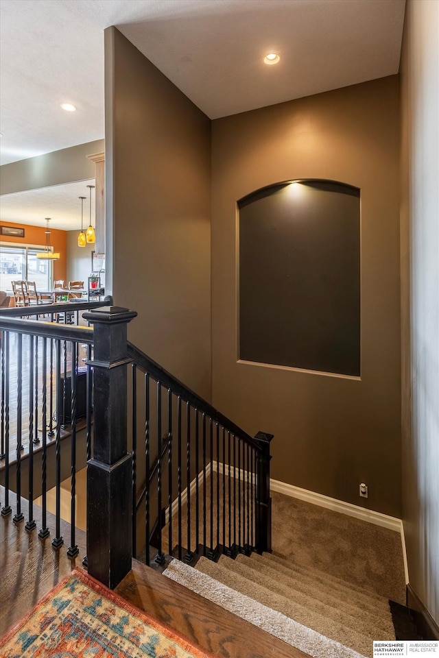 stairs with carpet floors, recessed lighting, and baseboards