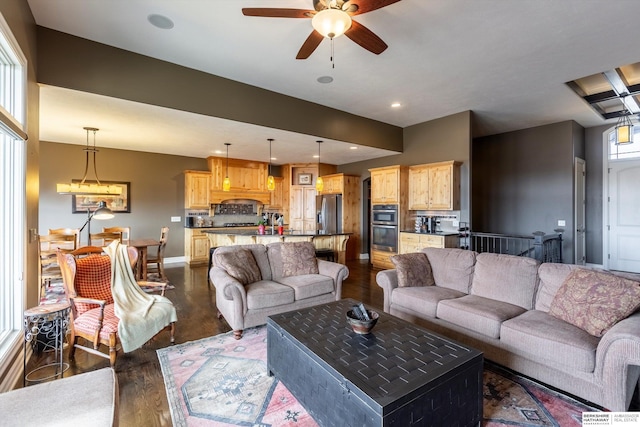 living area with baseboards, dark wood finished floors, a ceiling fan, and recessed lighting