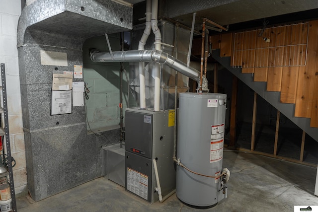 utility room with gas water heater