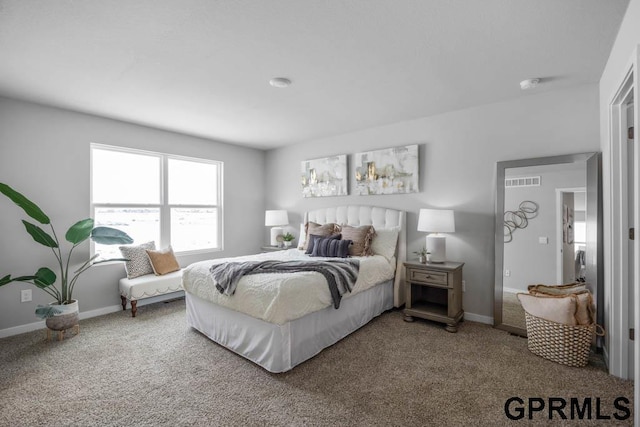 bedroom featuring visible vents, baseboards, and carpet flooring