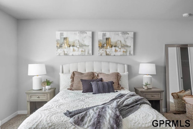 bedroom featuring carpet and baseboards