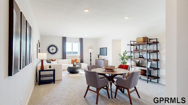 carpeted dining space featuring recessed lighting and baseboards