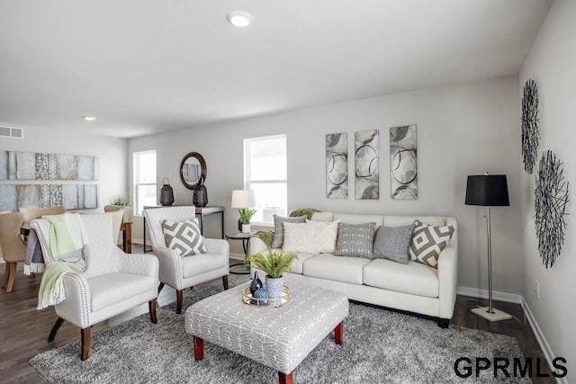 living room with recessed lighting, wood finished floors, visible vents, and baseboards