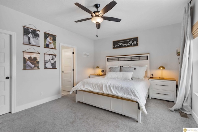 carpeted bedroom featuring ceiling fan and baseboards