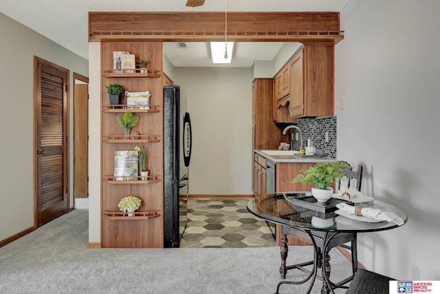 kitchen with light carpet, a sink, light countertops, decorative backsplash, and open shelves