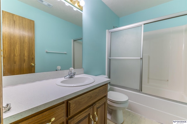 full bath with toilet, enclosed tub / shower combo, visible vents, and vanity