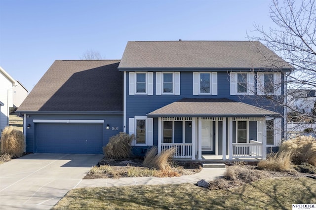 colonial-style house with a garage, driveway, a porch, and a shingled roof