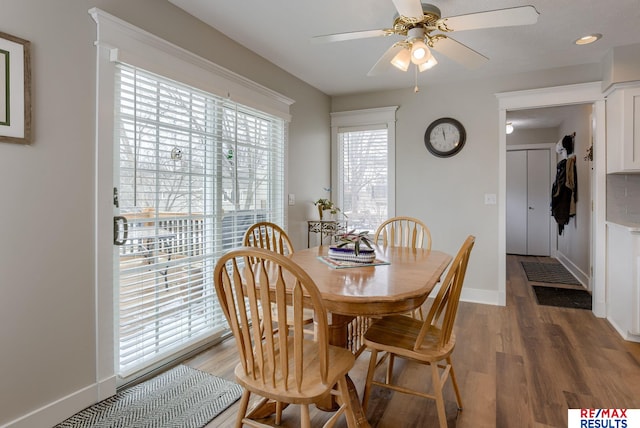 dining room with recessed lighting, ceiling fan, baseboards, and wood finished floors