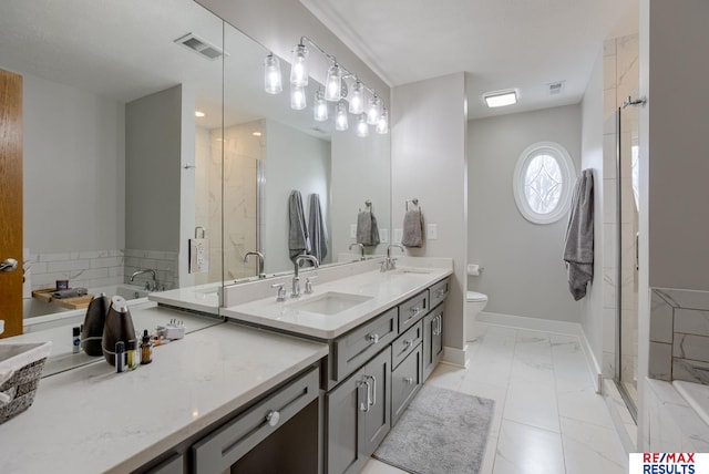 full bathroom featuring double vanity, a stall shower, a sink, and visible vents