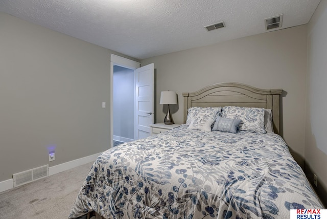 bedroom with carpet floors, visible vents, and baseboards