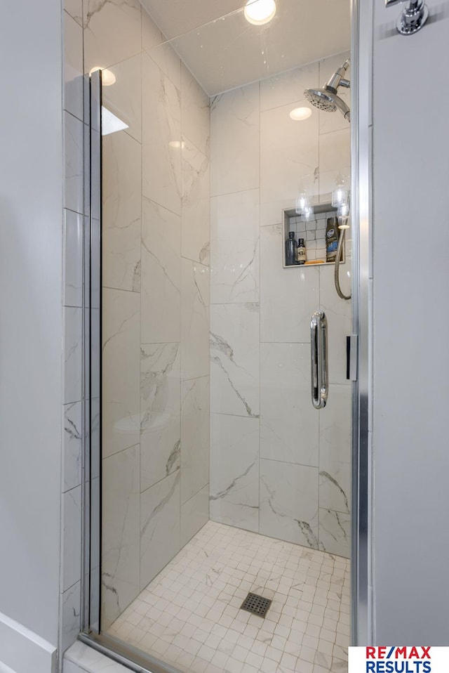 full bath with a shower stall