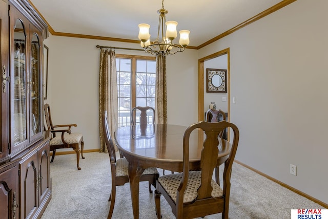 dining area featuring ornamental molding, light colored carpet, baseboards, and an inviting chandelier