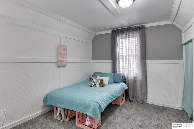 bedroom with crown molding, carpet, visible vents, and vaulted ceiling