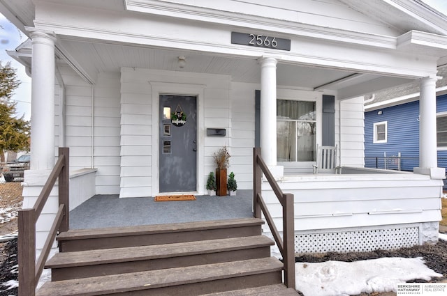 entrance to property with a porch