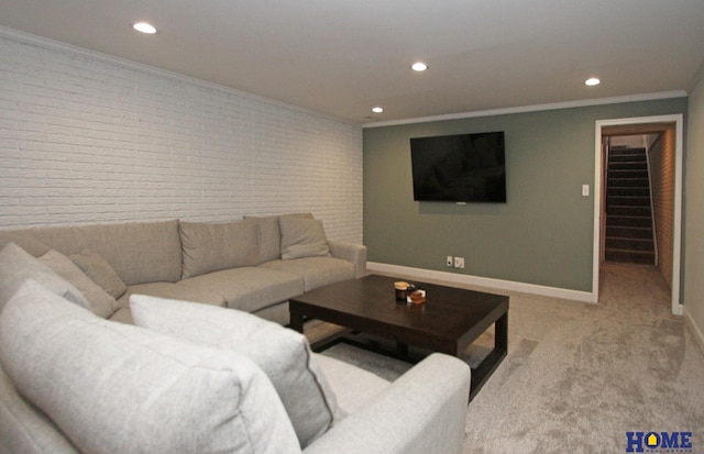 living room with baseboards, brick wall, stairs, crown molding, and recessed lighting