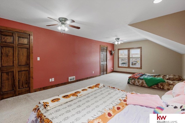 carpeted bedroom with lofted ceiling, visible vents, ceiling fan, and baseboards