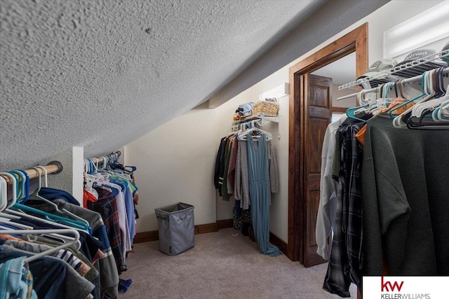 walk in closet featuring carpet