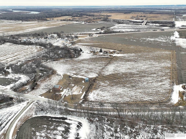 snowy aerial view with a rural view