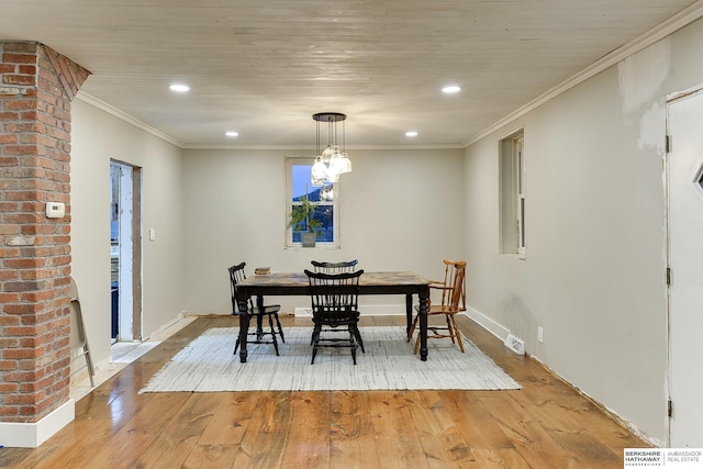 dining space with light wood finished floors, recessed lighting, visible vents, and crown molding