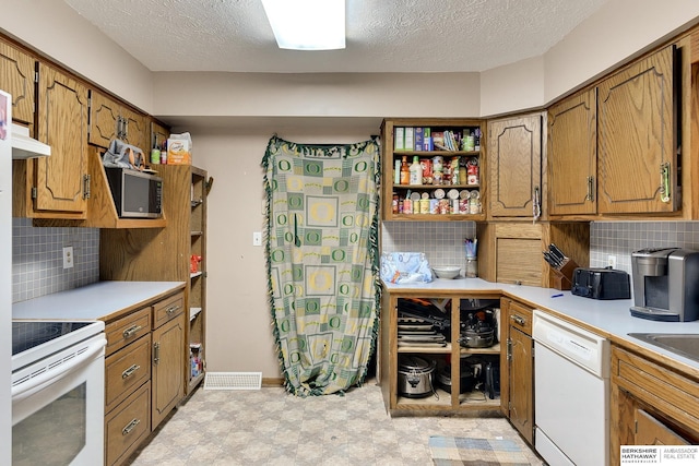 kitchen featuring light floors, open shelves, light countertops, ventilation hood, and white appliances