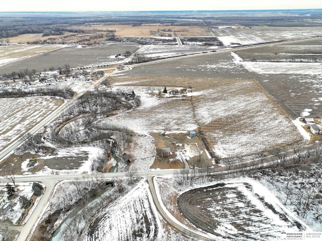 snowy aerial view with a rural view