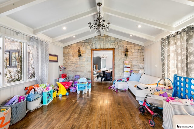 playroom with vaulted ceiling with beams, an inviting chandelier, and wood finished floors