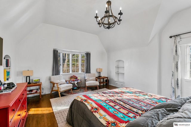 bedroom with lofted ceiling, multiple windows, dark wood-style floors, and an inviting chandelier