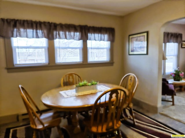 dining space with arched walkways