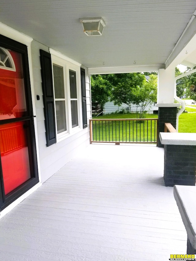 wooden terrace with a porch