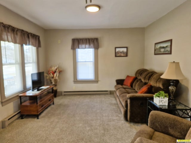 carpeted living area featuring a baseboard heating unit and baseboard heating