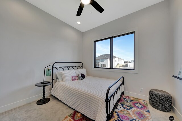 carpeted bedroom featuring lofted ceiling, ceiling fan, baseboards, and recessed lighting