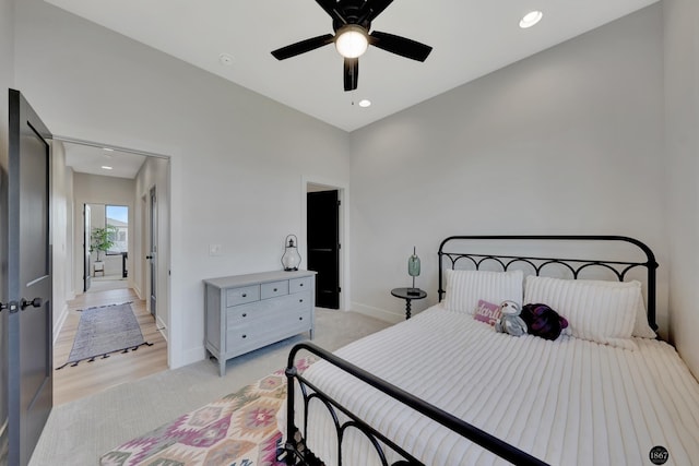 bedroom with light carpet, baseboards, a ceiling fan, and recessed lighting