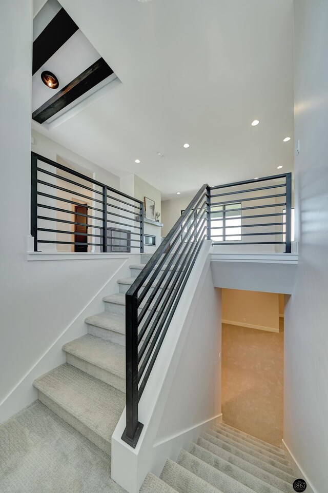 stairs featuring baseboards, carpet flooring, and recessed lighting